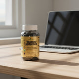 pot de gummies vitaboost perfomeur posé sur un bureau près d'un ordinateur